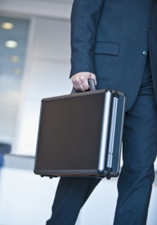 Businessman holding briefcase.