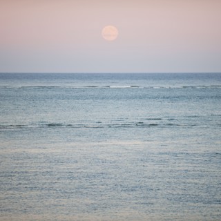 Moonrise over ocean.