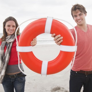Couple holding life ring