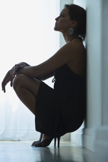 Woman leaning against wall