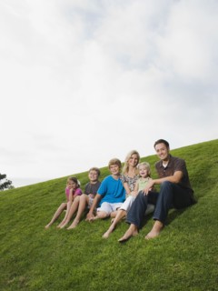 Family sitting on grass