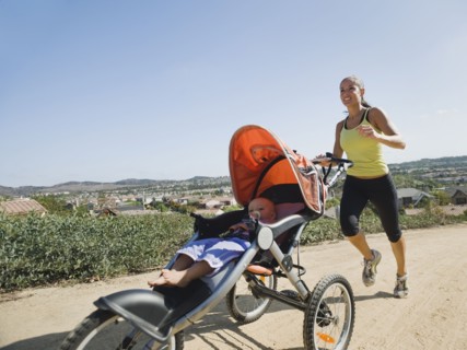 Woman jogging with stroller