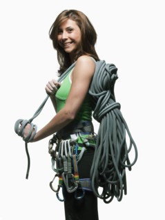 Portrait of a woman with climbing gear