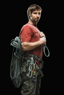 Portrait of male climber holding rope