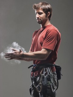 Climber putting chalk on hands