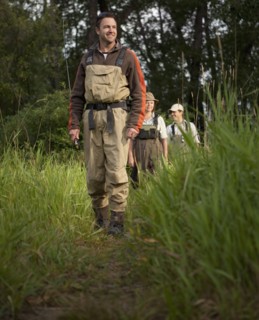 Fly Fisherman walking on path