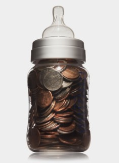 Baby bottle full of coins