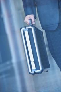 Businessman holding briefcase.