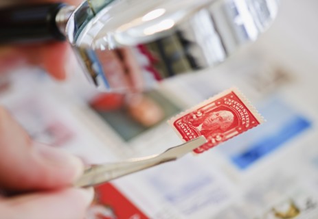Looking at stamp.