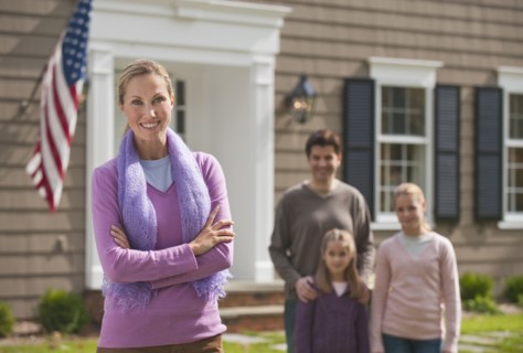 Family in front of house.