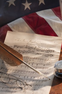 Sheet music on American flag.