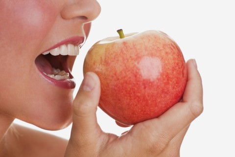 Woman eating apple
