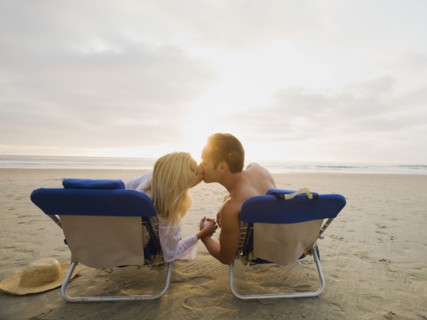Couple kissing at the beach