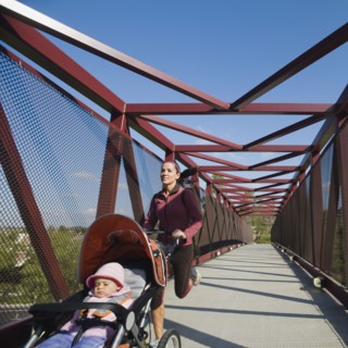 Woman jogging with stroller