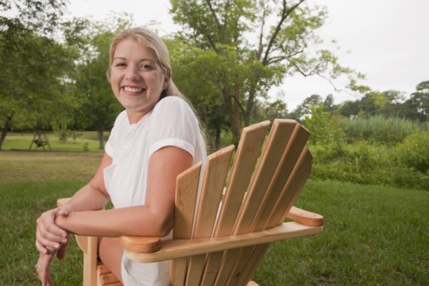 Woman in Adirondack chair