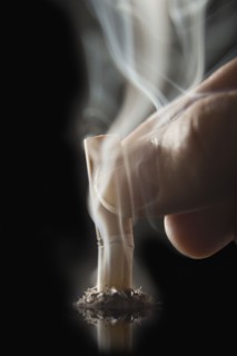 Finger putting out cigarette