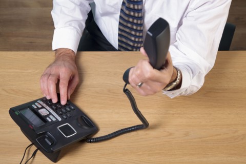 Man dialing phone