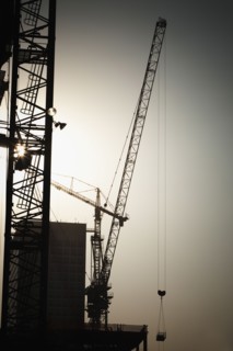 Cranes and high-rise building under construction