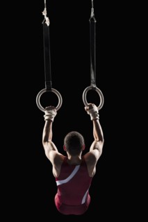 Gymnast swinging from rings