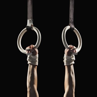 Gymnast swinging from rings
