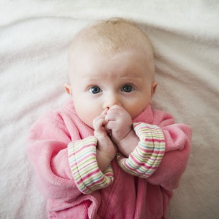Portrait of baby girl in pink robe