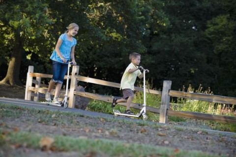 Children riding scooters