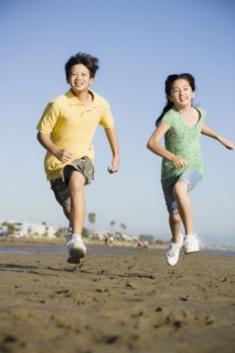Children running on beach