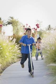 Children riding scooters