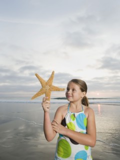 Girl holding starfish
