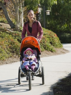 Woman jogging with stroller