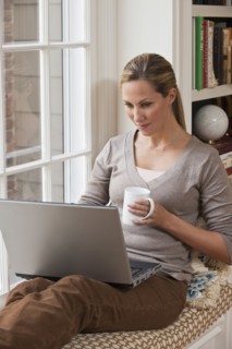 Woman working on laptop.