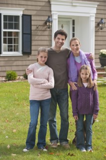 Family in front of house.