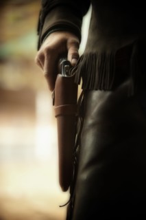 Cowboy with gun in holster.