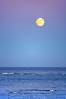 Moonrise over ocean.