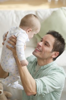 Father holding baby.