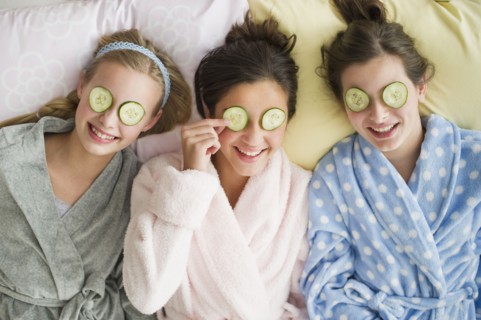 Girls having a facial.