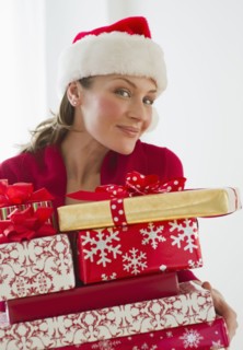 Woman holding Christmas presents.