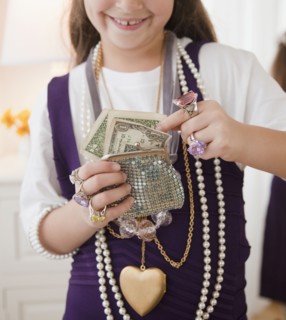 Young girl playing dress-up. Photographer: Jamie Grill