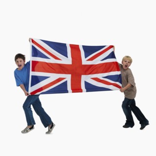 Children carrying flag. Photographer: momentimages