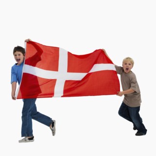 Children carrying flag. Photographer: momentimages