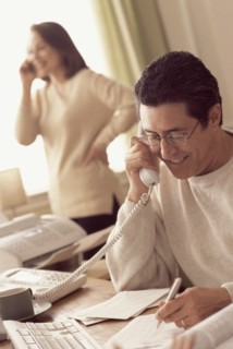Couple working in home office. Photographer: Rob Lewine