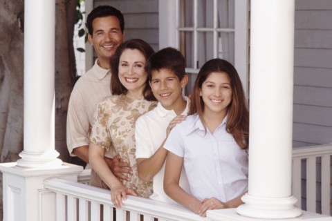 Family portrait on the porch. Photographer: Rob Lewine