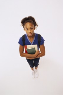 Student holding books. Photographer: Rob Lewine