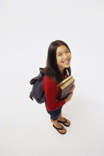 Student holding books. Photographer: Rob Lewine
