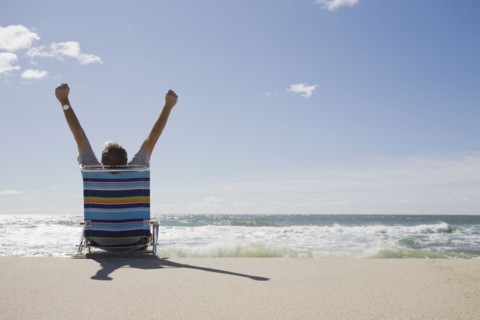 Relaxing on the beach. Photographer: Chris Hackett