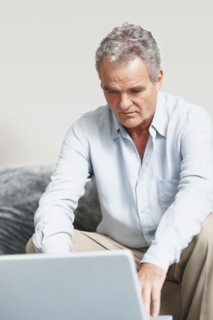 Man working on laptop. Photographer: momentimages