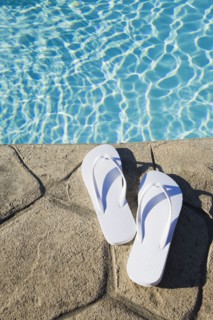 Flip flops by the pool. Photographer: Chris Hackett