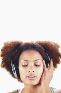 Woman listening to music. Photographer: momentimages