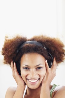 Woman listening to music. Photographer: momentimages