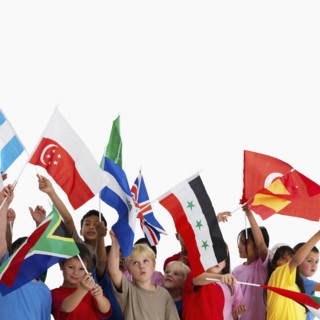 Children waving flags. Photographer: momentimages